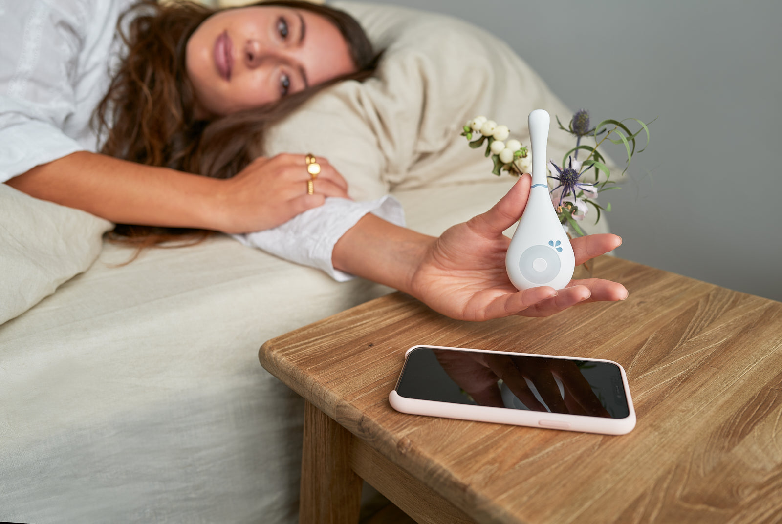 Woman journaling her menstrual cycle data in a calm, sunlit space, representing period tracking and fertility awareness