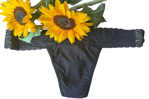 Black thong with sunflower decorations on a white background