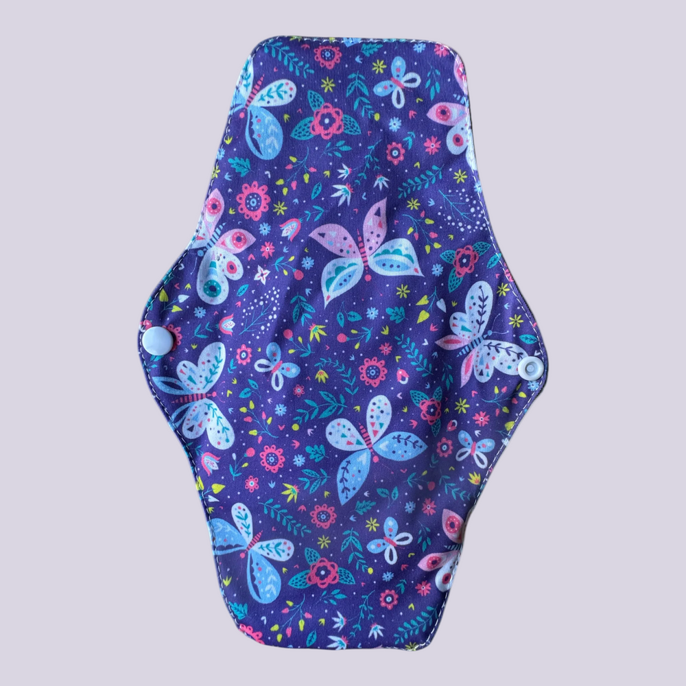 Reusable sanitary pad with owl pattern on a blue background